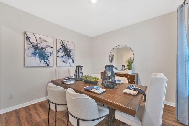 dining area featuring dark hardwood / wood-style floors