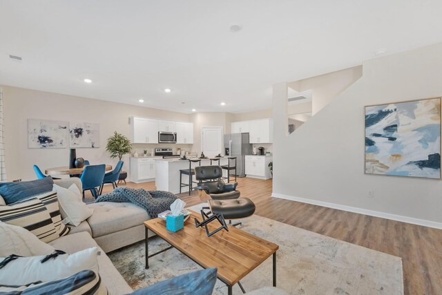 living room featuring light wood-type flooring