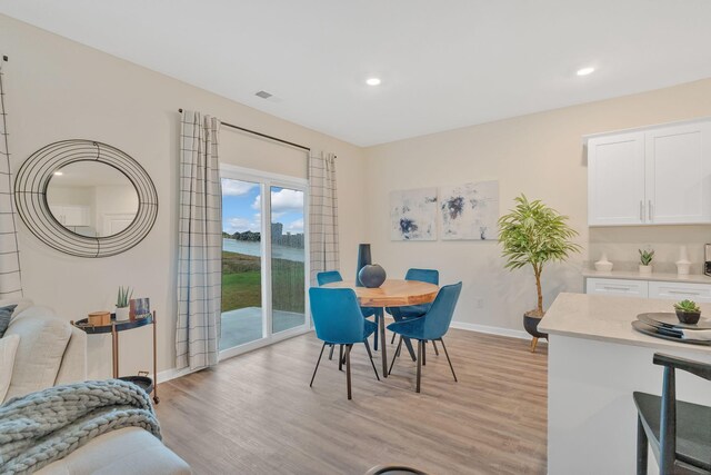 dining room featuring light hardwood / wood-style flooring