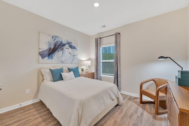 bedroom featuring light hardwood / wood-style floors