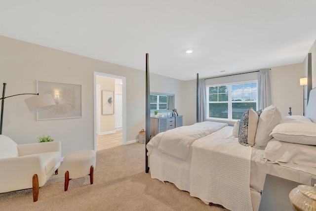 carpeted bedroom with ensuite bath