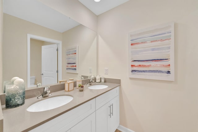 bathroom with vanity and toilet