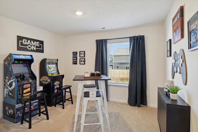 office featuring a textured ceiling and light colored carpet