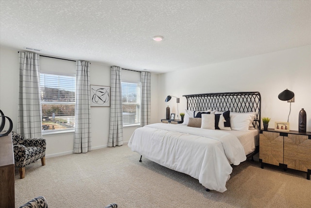 carpeted bedroom featuring a textured ceiling