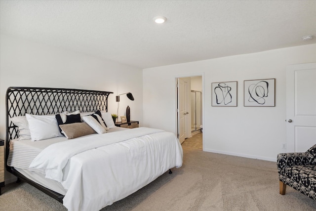 carpeted bedroom with a textured ceiling