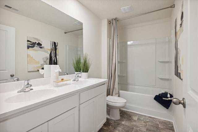 full bathroom with vanity, toilet, and shower / bath combination with curtain