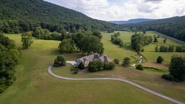 birds eye view of property with a mountain view and a rural view