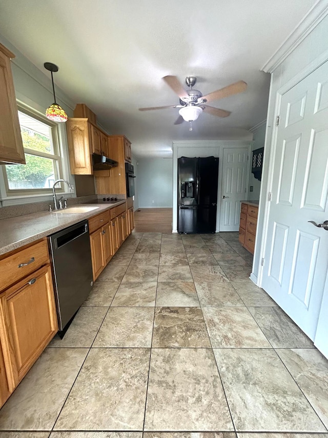 kitchen with ceiling fan, black appliances, pendant lighting, crown molding, and sink