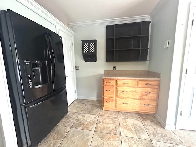 kitchen with light brown cabinets, black refrigerator with ice dispenser, light tile patterned flooring, and crown molding