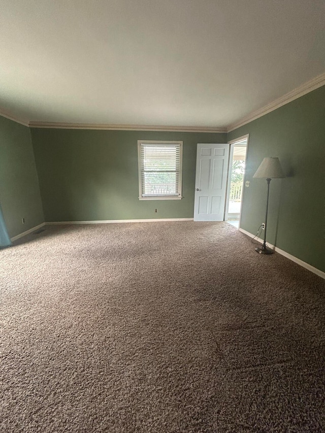 carpeted spare room with ornamental molding