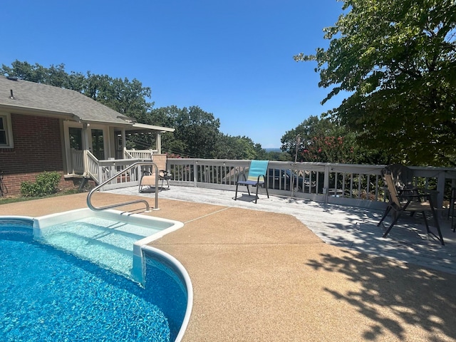 view of pool featuring a patio