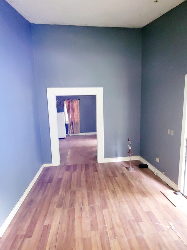 spare room featuring hardwood / wood-style floors