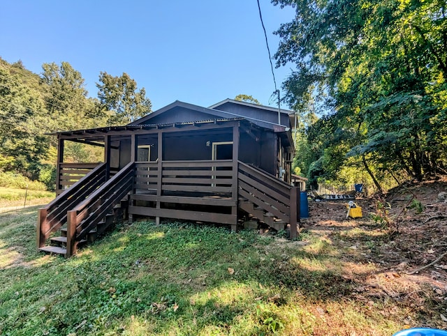 rear view of property with a yard