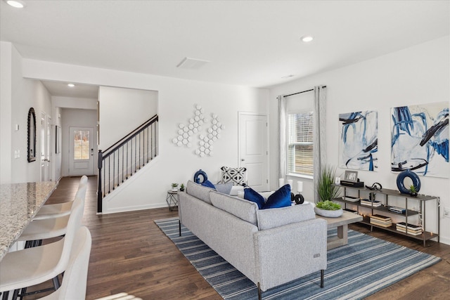 living room with dark hardwood / wood-style floors