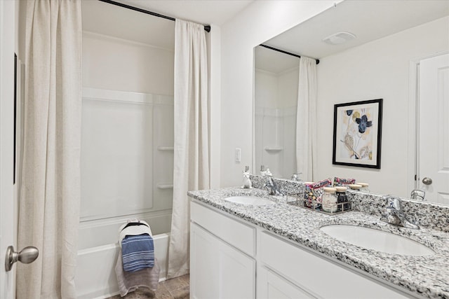 bathroom featuring vanity and shower / bath combo with shower curtain