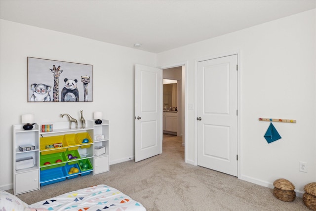 bedroom featuring light carpet