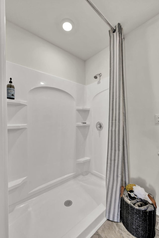 bathroom featuring a shower stall