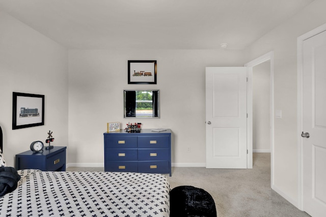 carpeted bedroom with baseboards