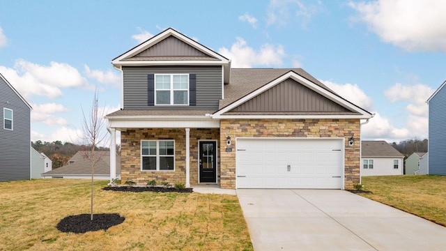 craftsman house with board and batten siding, a front lawn, a garage, stone siding, and driveway