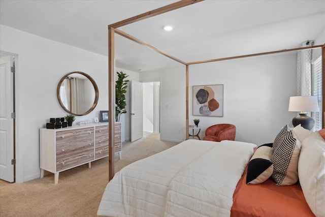 bedroom featuring light colored carpet