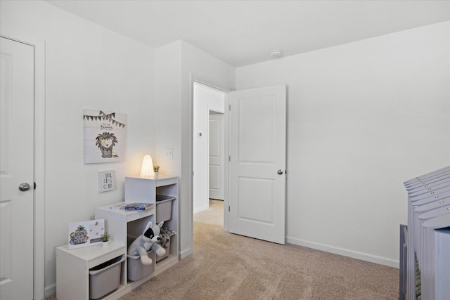 bedroom featuring light carpet