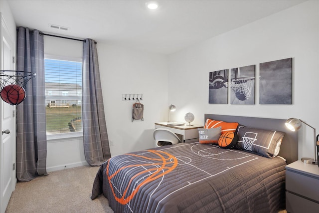 bedroom with light colored carpet