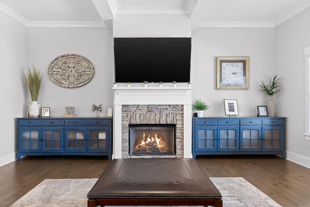 living room featuring ornamental molding, dark hardwood / wood-style floors, and a fireplace