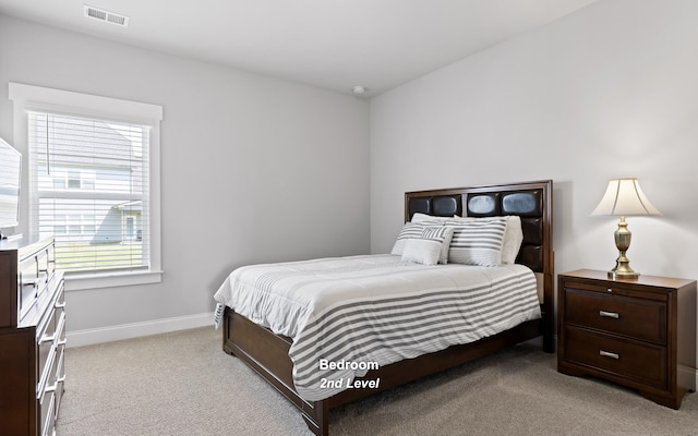 bedroom featuring light colored carpet