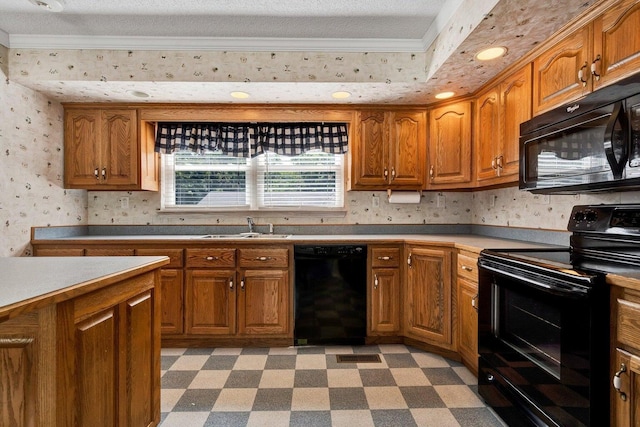 kitchen with a sink, light floors, black appliances, and brown cabinets