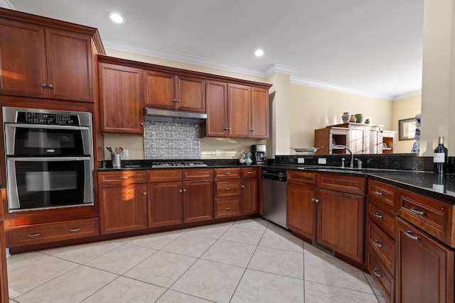 kitchen featuring ornamental molding, dark stone counters, light tile patterned floors, and stainless steel appliances