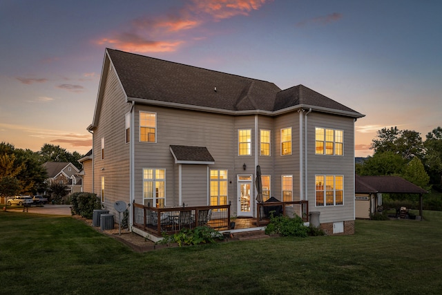 back house at dusk with a yard