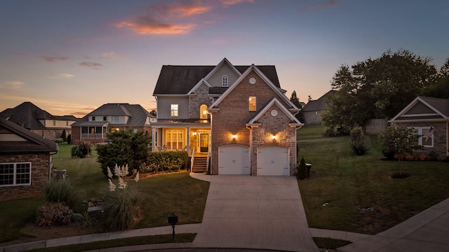 view of front of house with a yard, a garage, and a porch