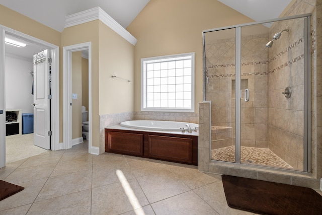 bathroom with vaulted ceiling, independent shower and bath, tile patterned floors, and toilet