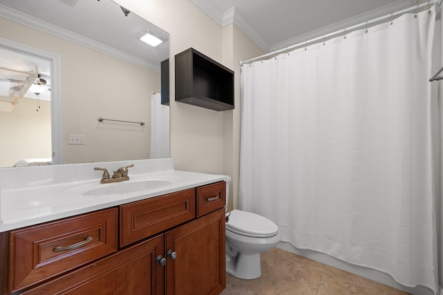 bathroom featuring tile patterned flooring, toilet, crown molding, and vanity