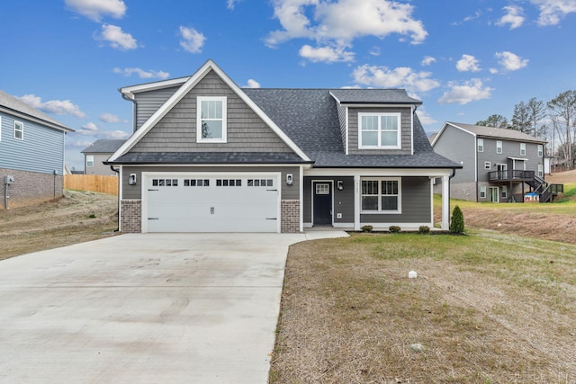 craftsman-style home featuring a front lawn and a garage