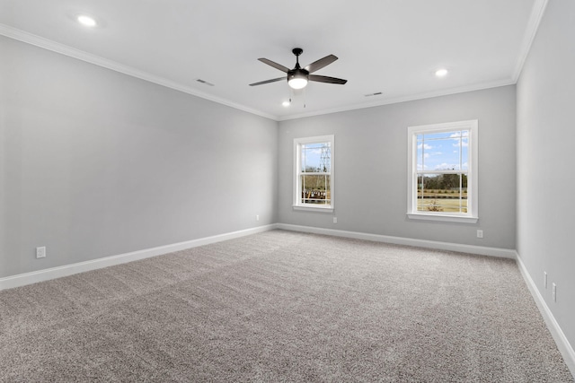 carpeted empty room featuring crown molding and ceiling fan