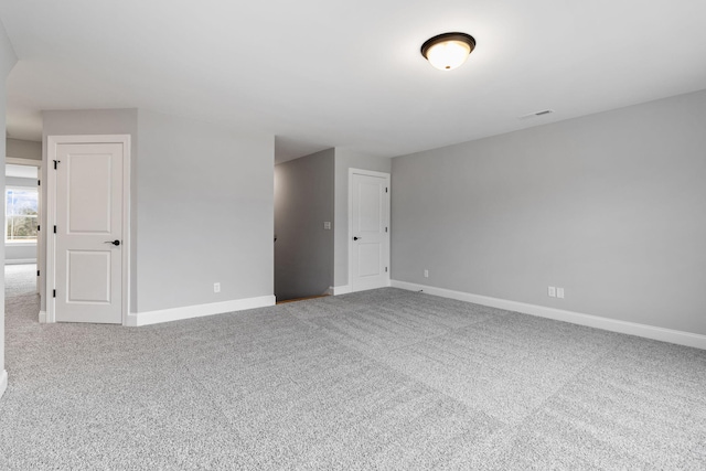 unfurnished room featuring carpet floors