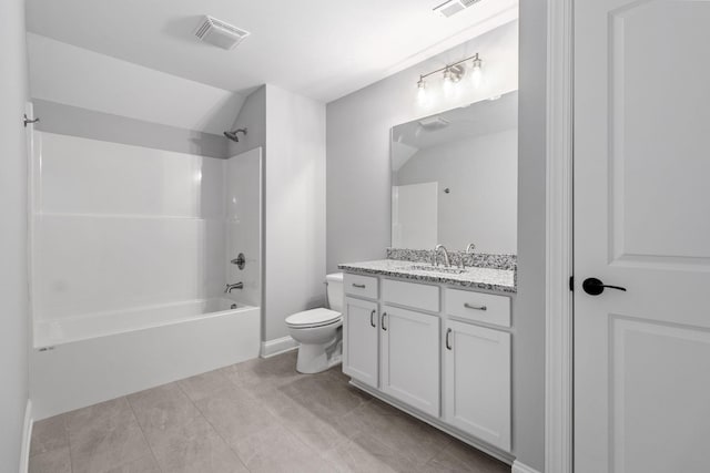 full bathroom featuring toilet, vaulted ceiling, tile patterned floors, vanity, and washtub / shower combination