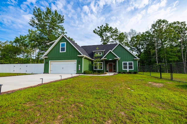 craftsman-style home with a front yard, fence, driveway, a garage, and board and batten siding