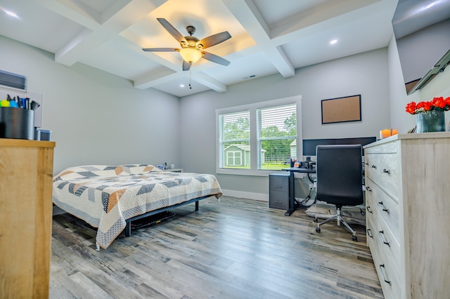 bedroom with ceiling fan, hardwood / wood-style floors, beamed ceiling, and coffered ceiling