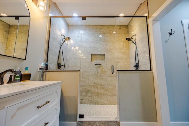 full bath featuring a stall shower and vanity