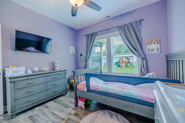 bedroom with light wood-type flooring and ceiling fan