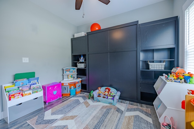 bedroom with hardwood / wood-style floors and ceiling fan