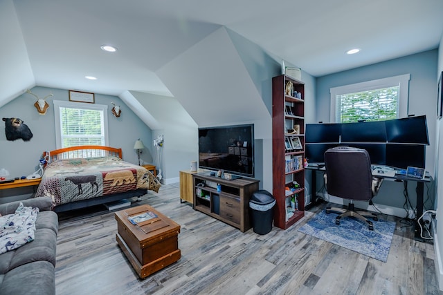 bedroom with lofted ceiling, recessed lighting, wood finished floors, and baseboards