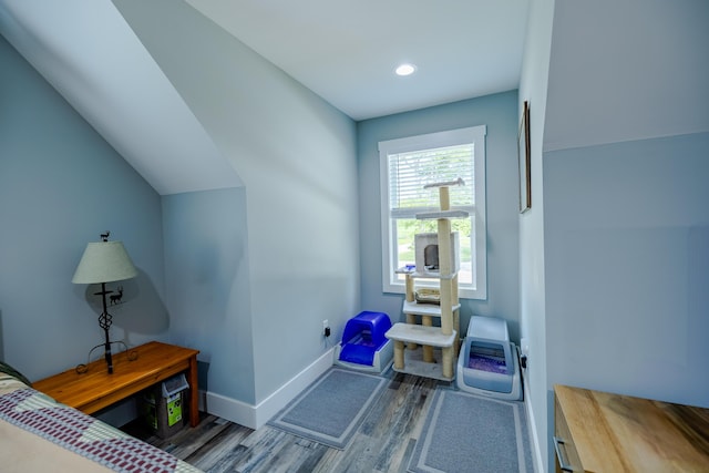 bedroom featuring vaulted ceiling, recessed lighting, baseboards, and wood finished floors