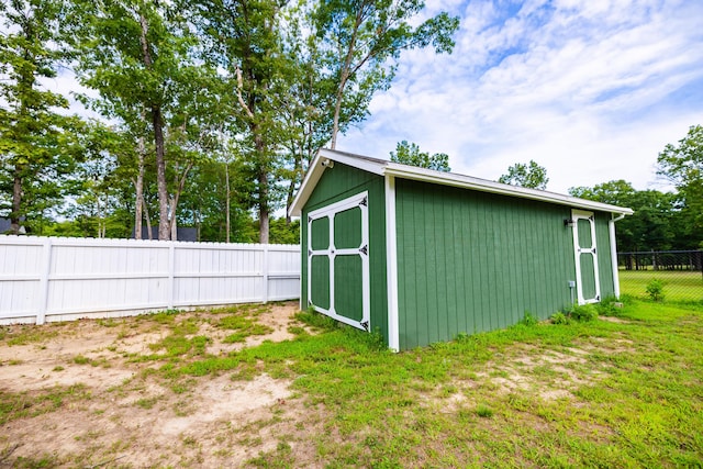 view of shed featuring a fenced backyard