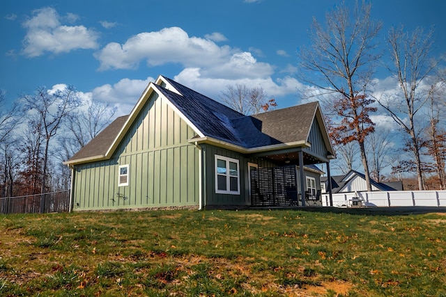 view of side of home featuring a yard