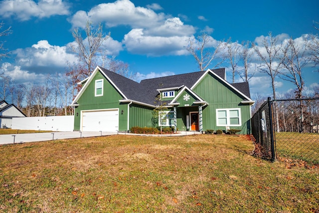 view of front of home with a front lawn and a garage