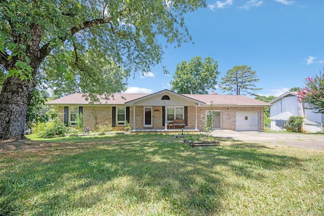 single story home with a porch, a garage, and a front lawn