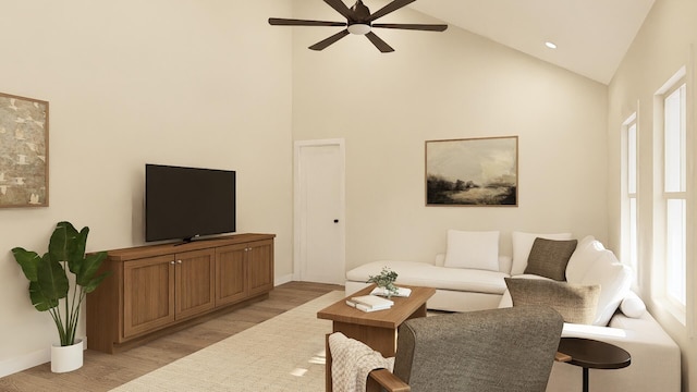 living room with high vaulted ceiling, ceiling fan, and light hardwood / wood-style flooring